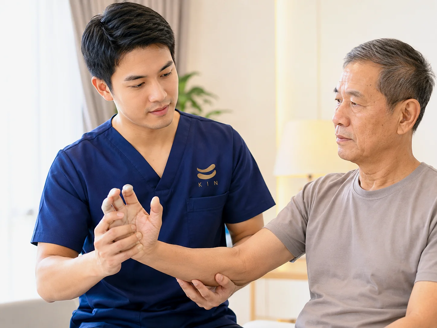 KIN physical therapist rehabilitating the hand and arm of a stroke patient with spasticity